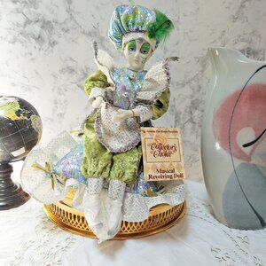 Vintage Harlequin Bisque Porcelain musical Doll on Ribbon Rffle Pillow in green